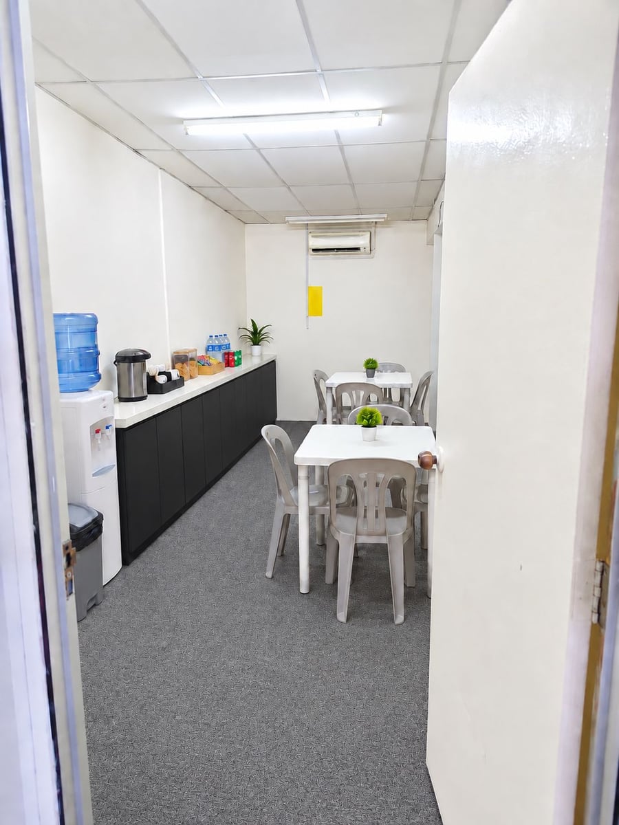 Pantry and refreshment area with water dispenser, coffee station and seating