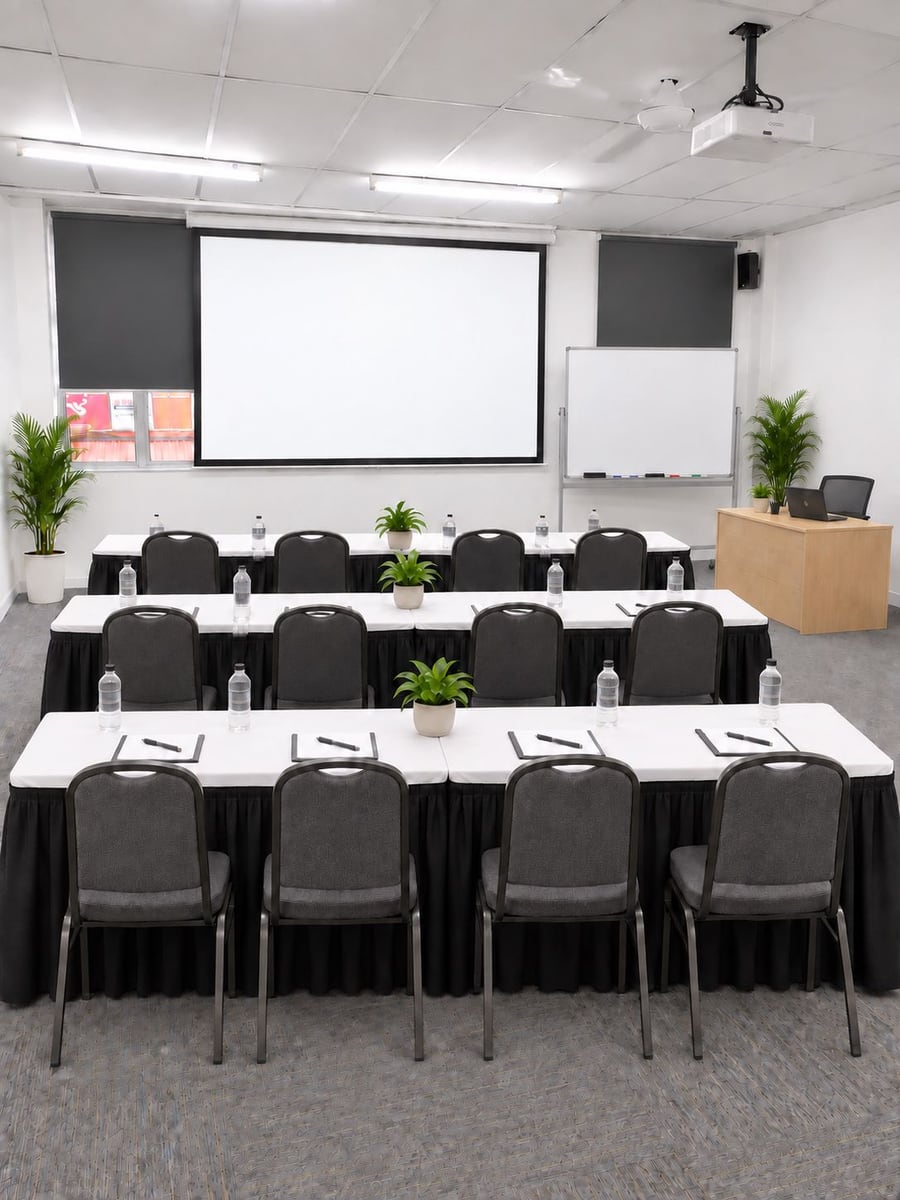 MSK Pro Global training room set up in classroom layout with projector screen and whiteboard